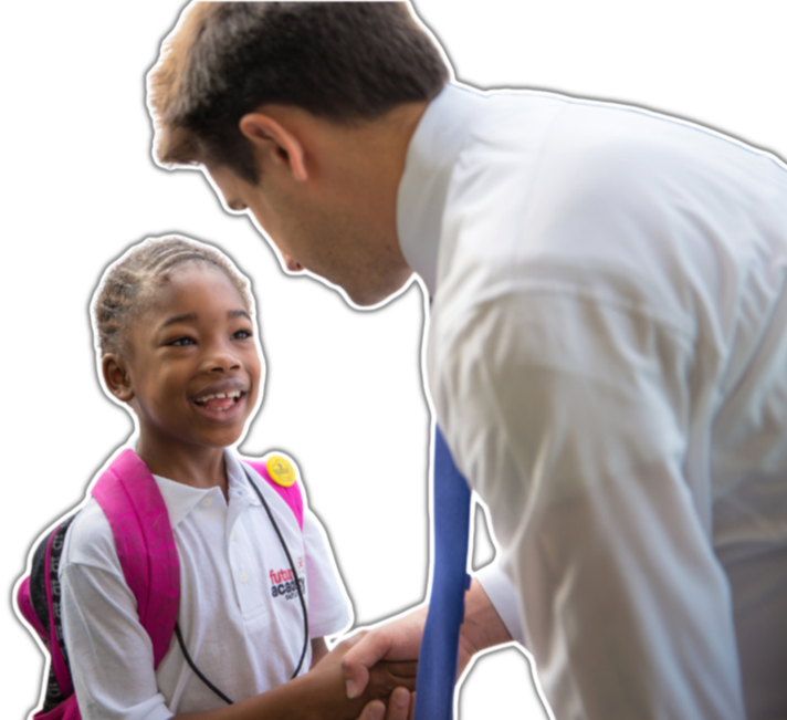 School leader greeting a student at the bus line.